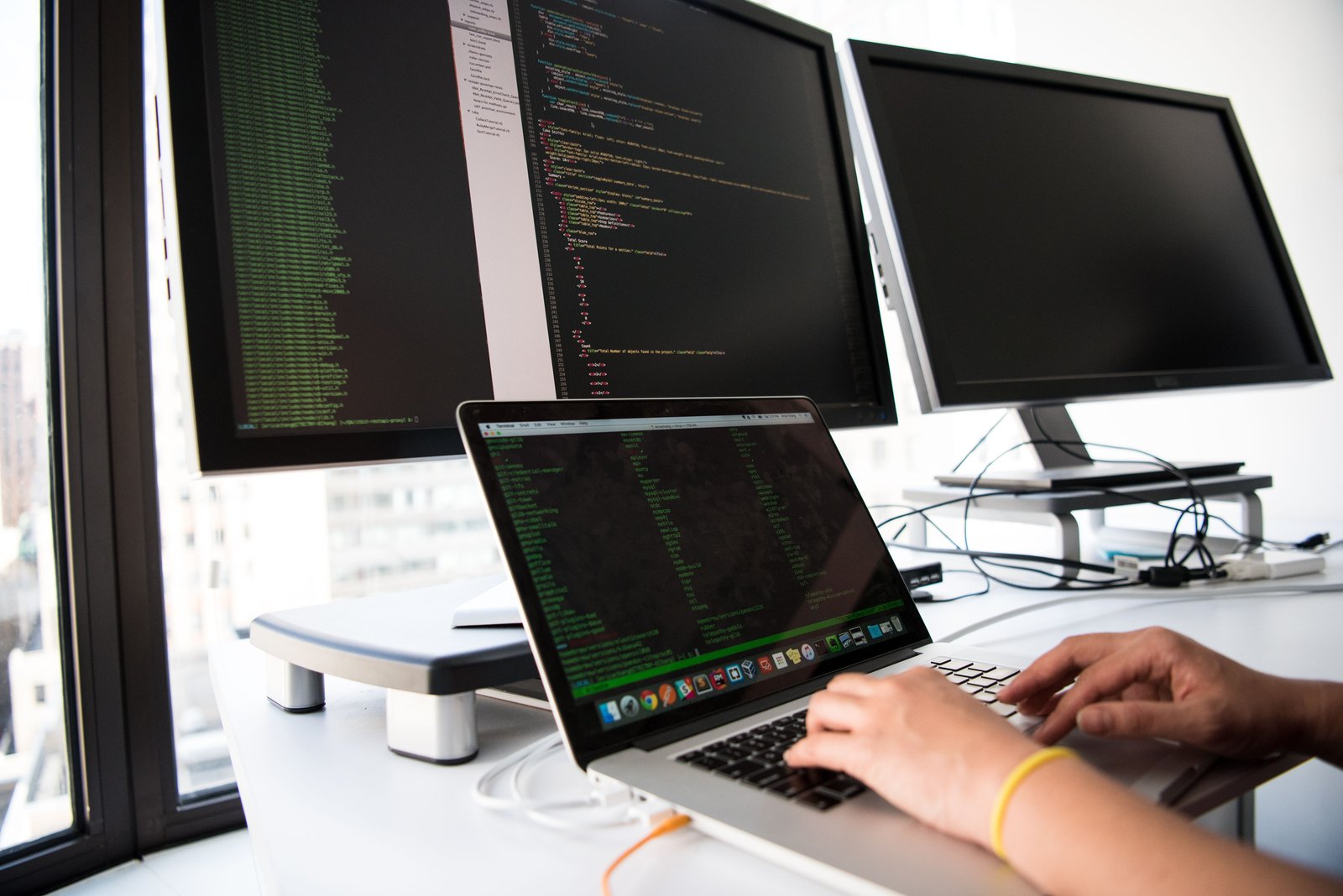 Developer building agent integrations across a dual-monitor workstation