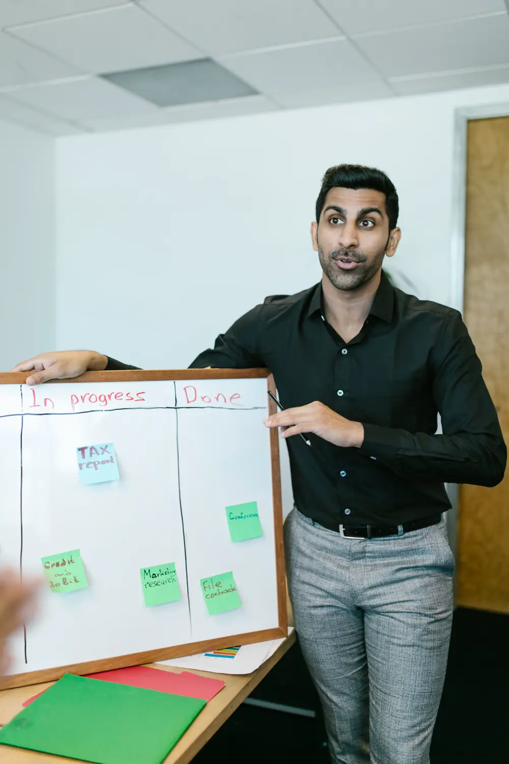 A team mapping a delivery plan on a whiteboard