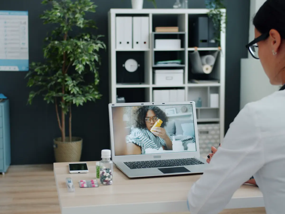 A healthcare professional in a virtual appointment with a patient