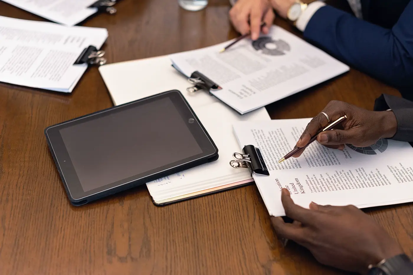 An underwriter reviewing a submission pack at their desk