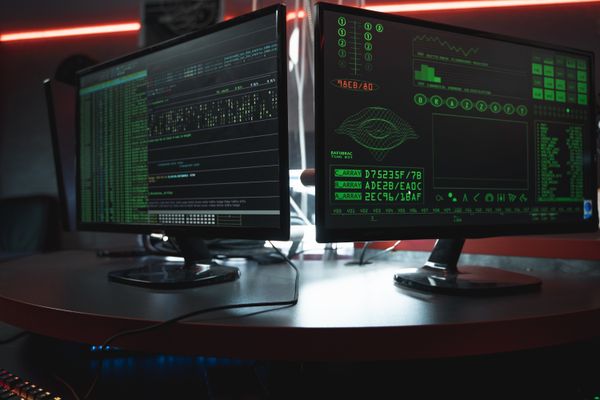 Dark monitoring room with terminals streaming live camera analysis output