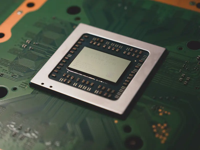Close-up of a processor package on a green circuit board