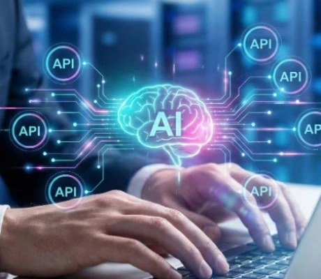 Hands typing on a laptop while an AI brain connects out to surrounding API endpoints