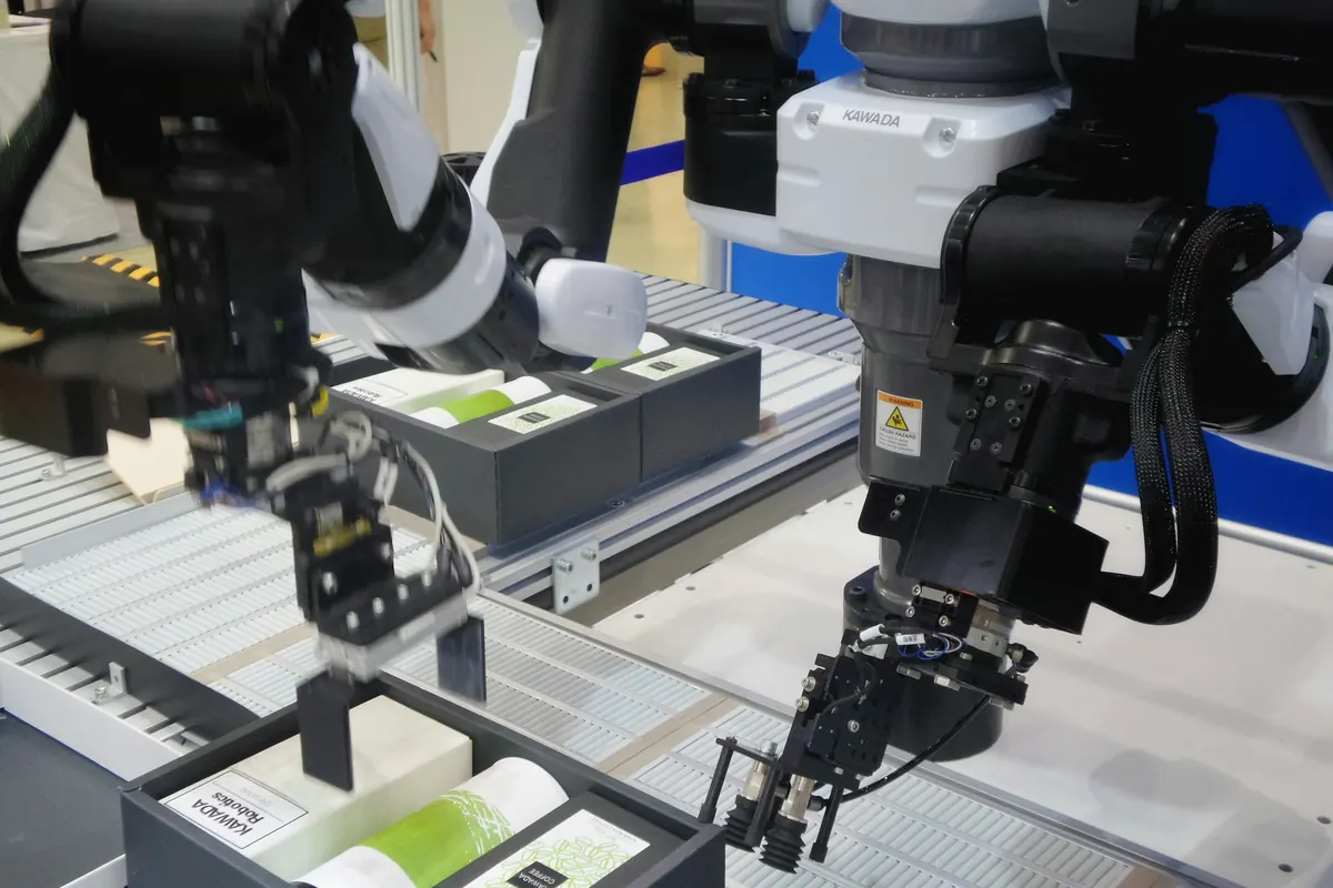 Robot arms sorting printed documents on an automated line