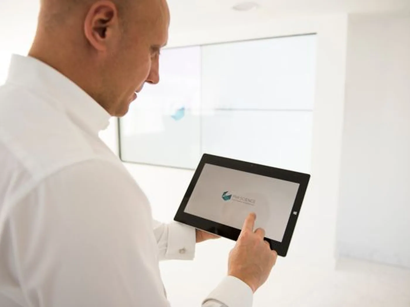 A marketing lead reviewing a campaign dashboard on a tablet