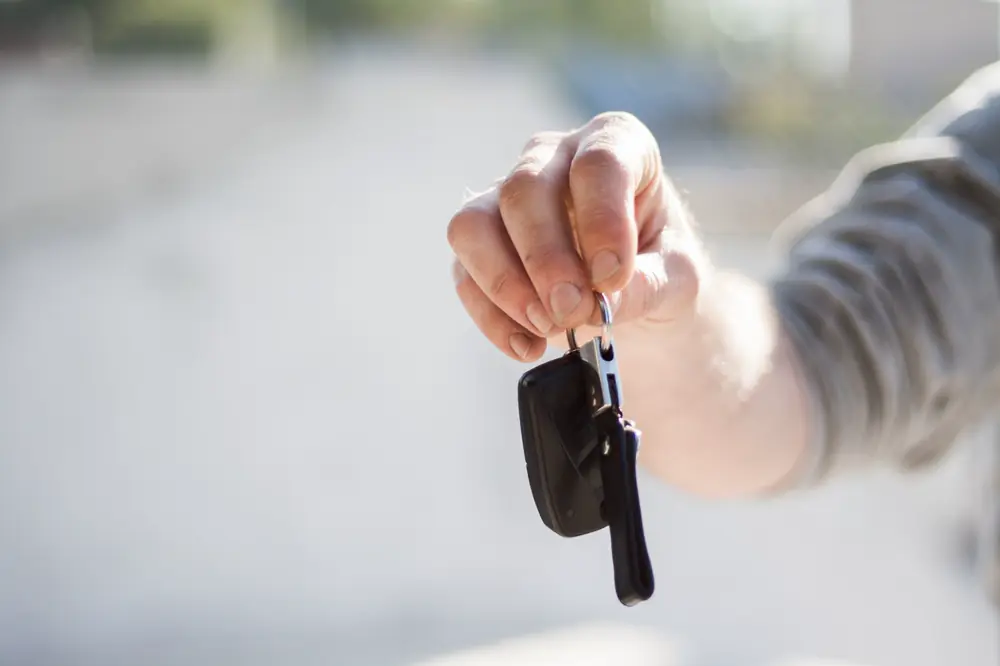 Car keys handed over at a dealership