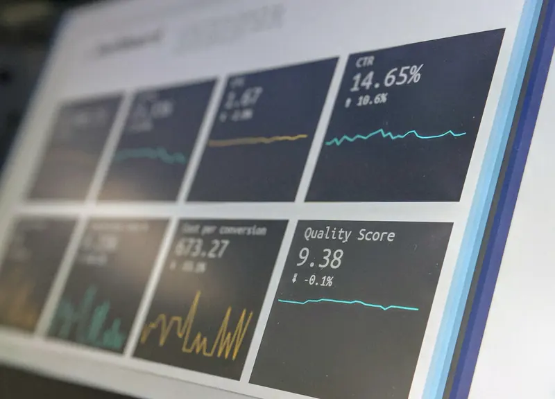 Monitoring dashboard with latency and quality metrics on a screen