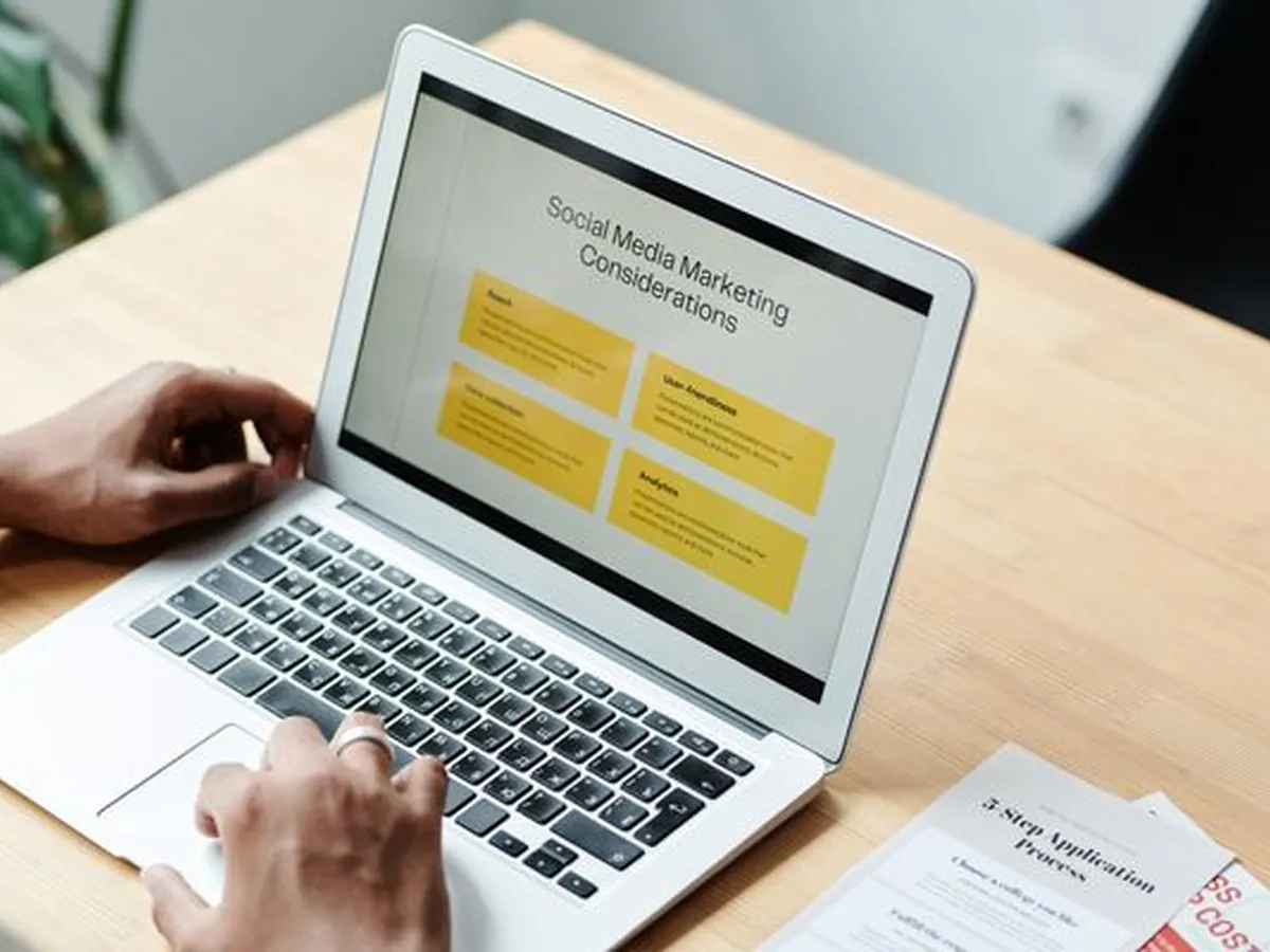 A content manager publishing a campaign page on a laptop