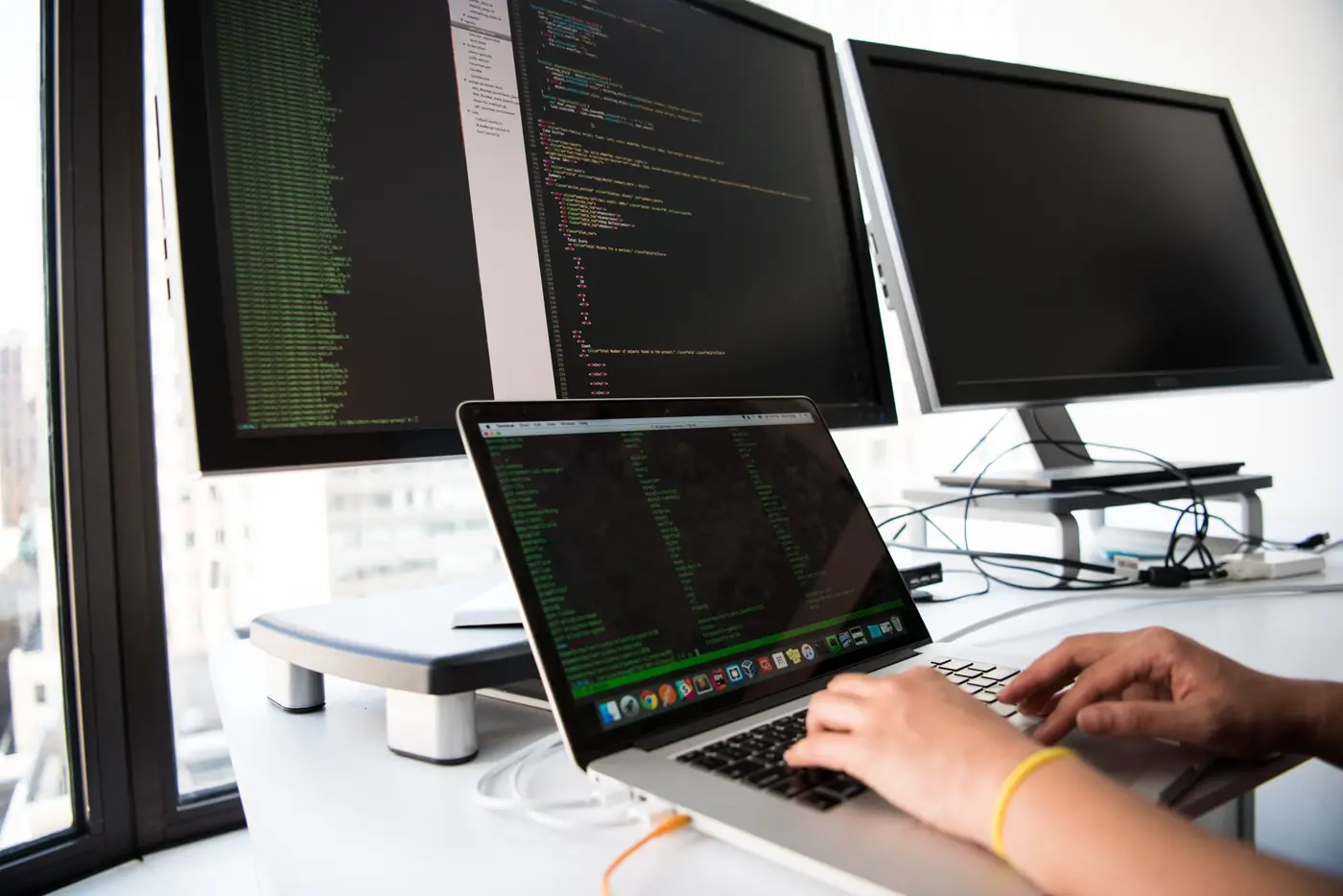 Engineers building an insurance platform across multiple screens
