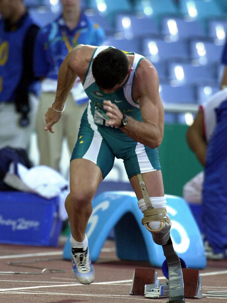 A sprinter set in the starting blocks