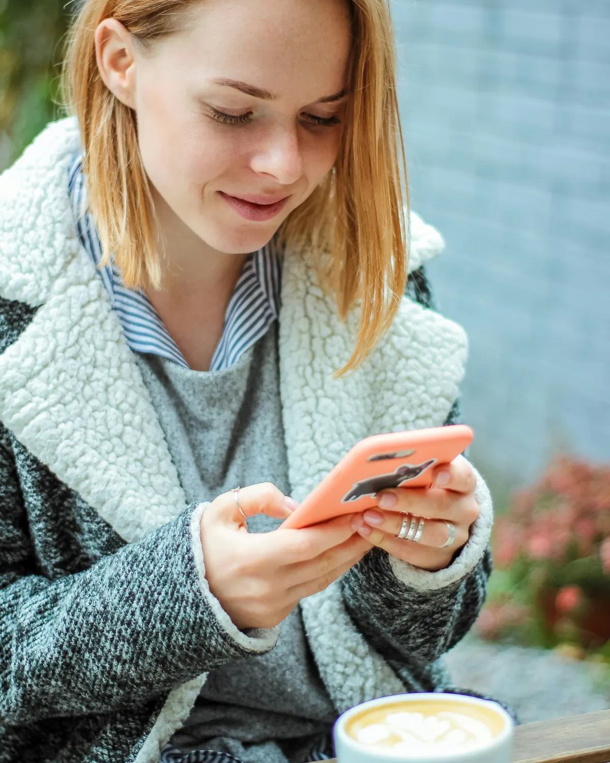 A business owner checking customer messages on a phone