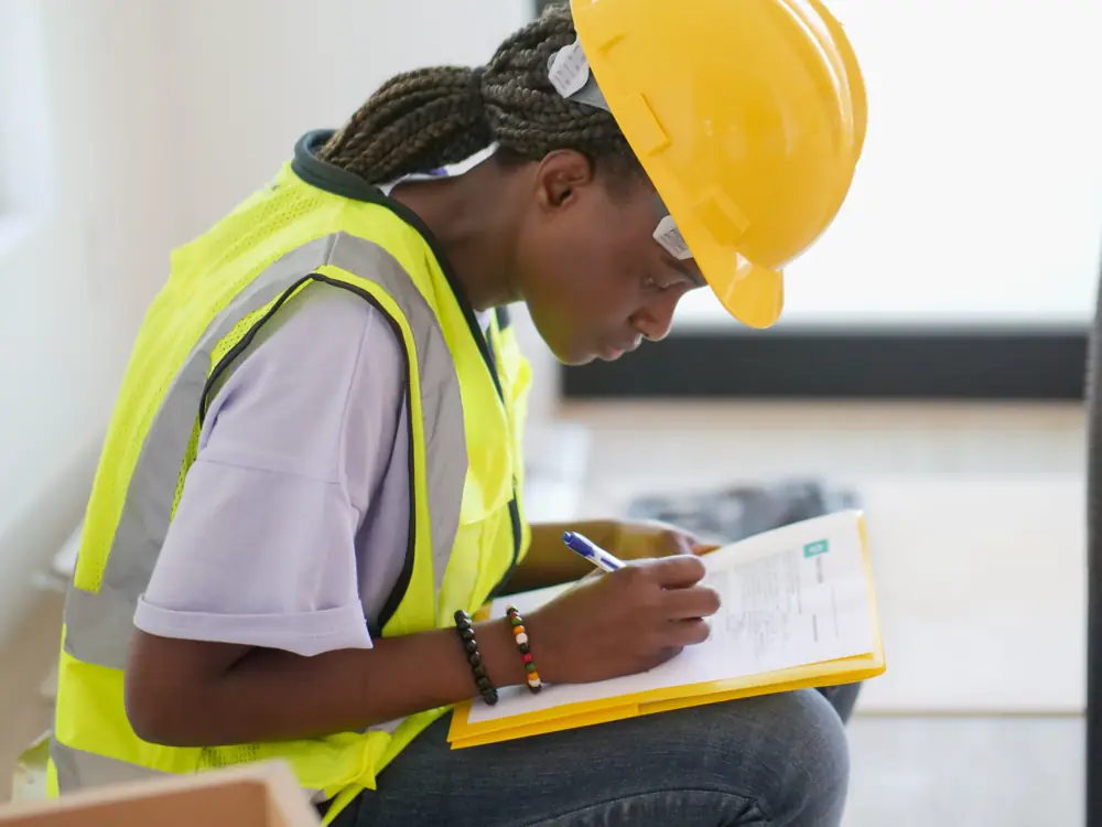 A claims assessor carrying out a site inspection