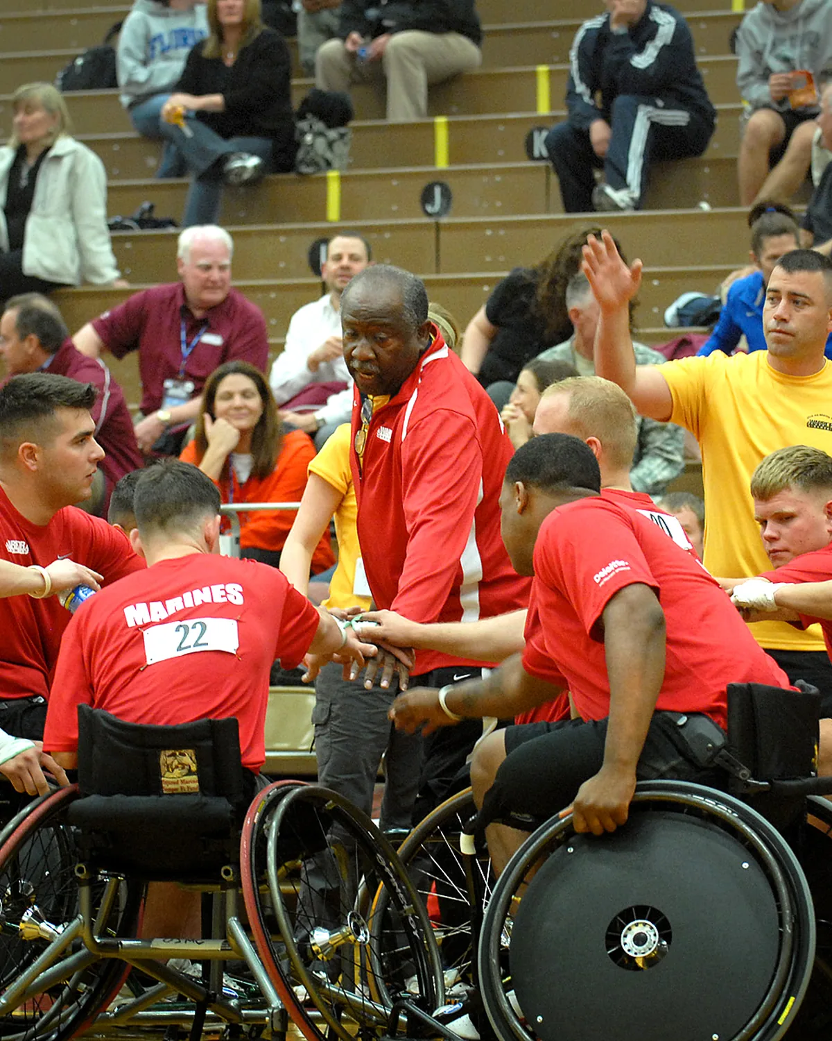 A coach working through a tactics board with the team