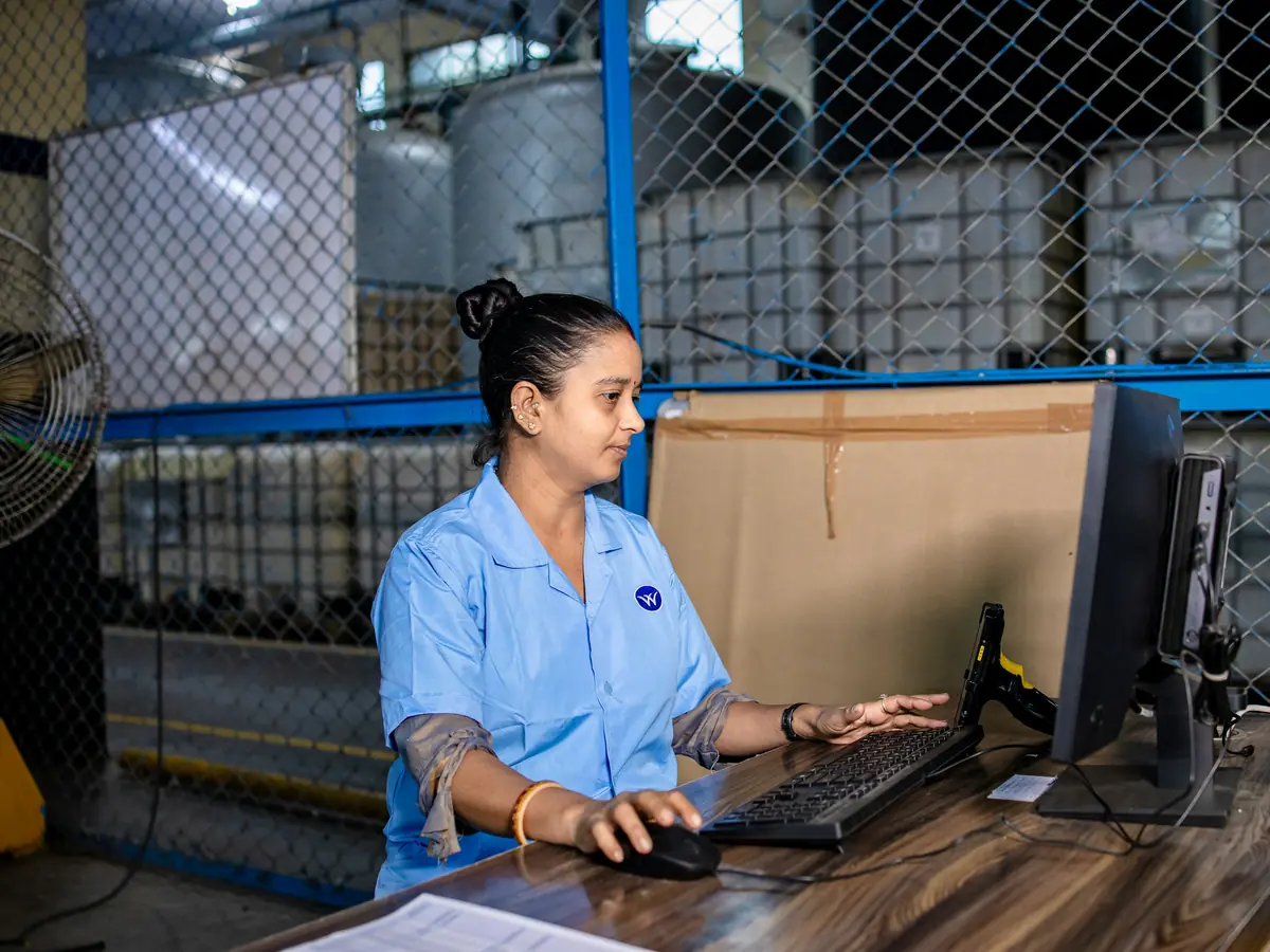 A supply chain manager reviewing operations on a tablet