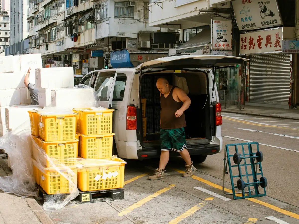 A distribution team confirming a delivery handover