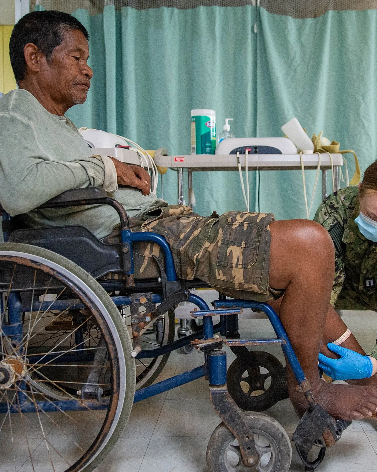 A therapist working on an athlete's leg