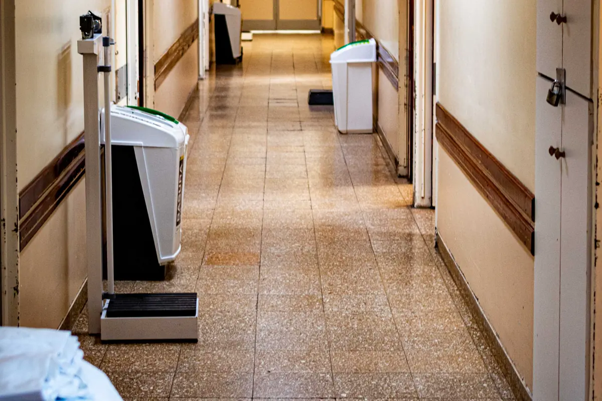 A quiet hospital corridor with clinical equipment