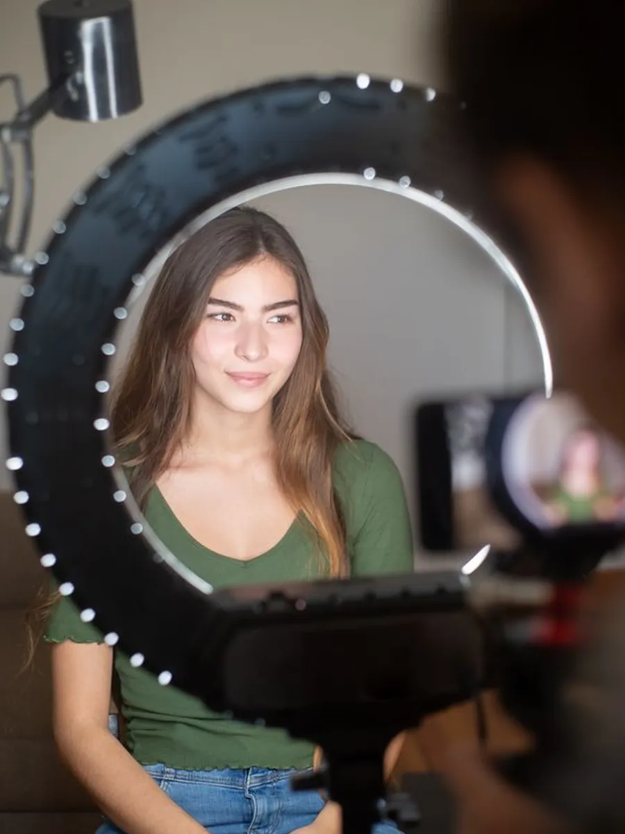 An influencer recording a video to camera
