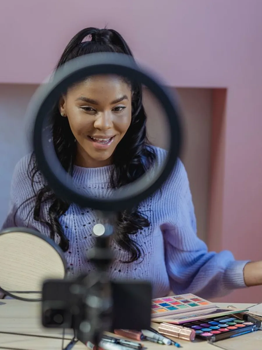 A creator filming social content with a ring light
