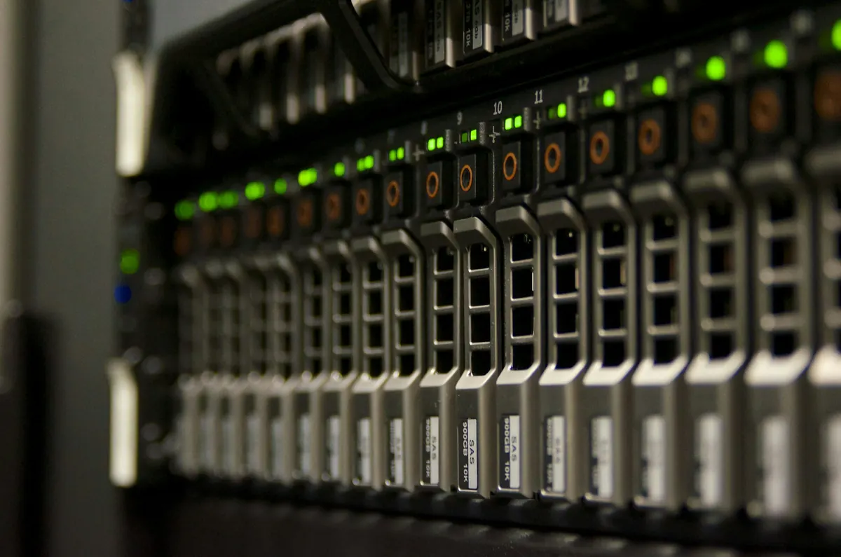 Rack of servers with green status lights in a data center