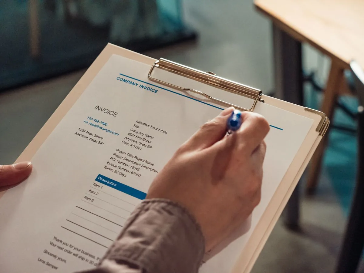 A compliance officer working through a checklist on a clipboard