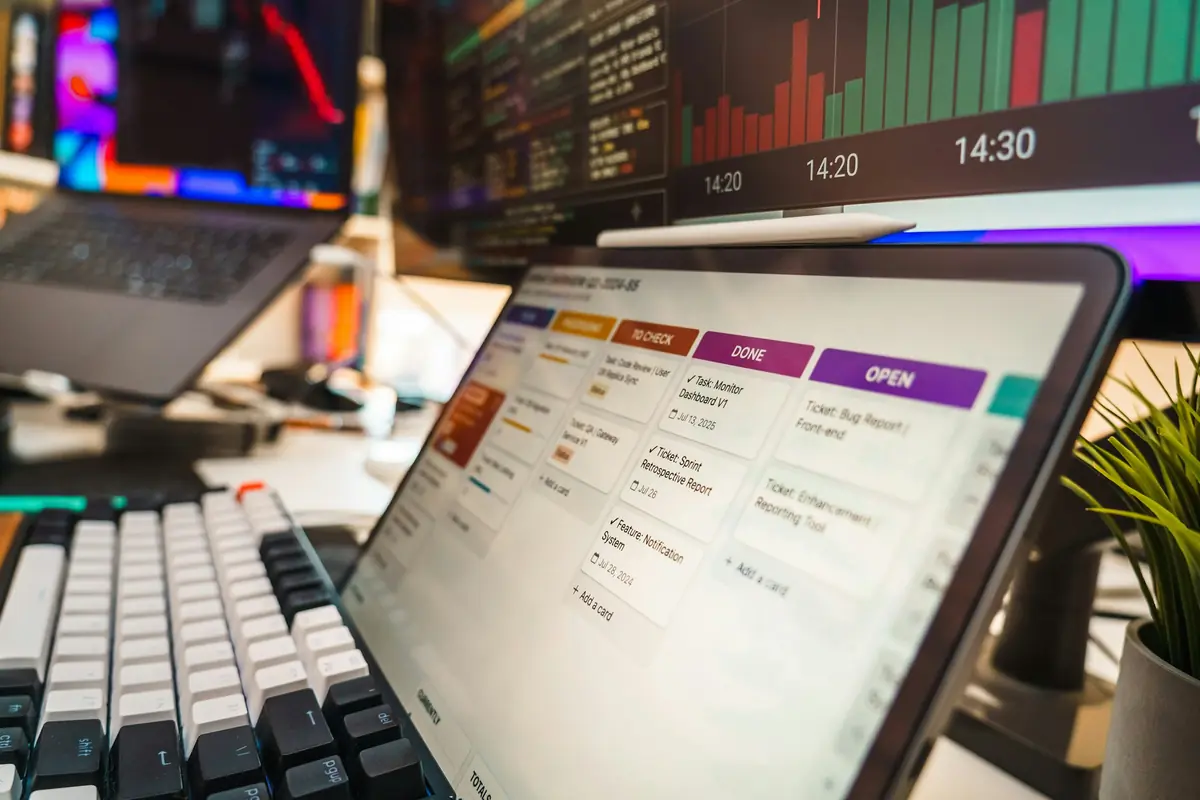 An ERP dashboard projected above a laptop on a desk