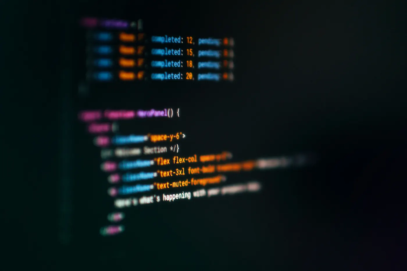 Code editor glowing on a dark screen