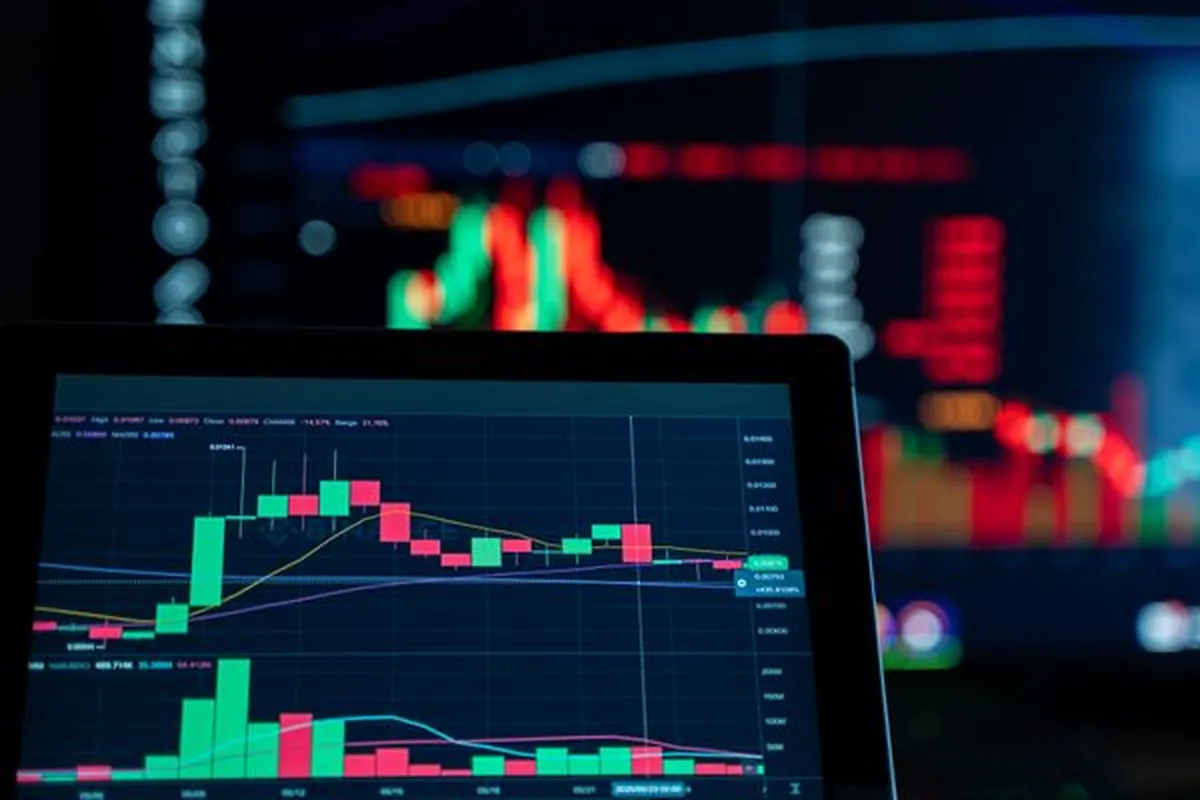 Trading screens showing live bid activity in green and red