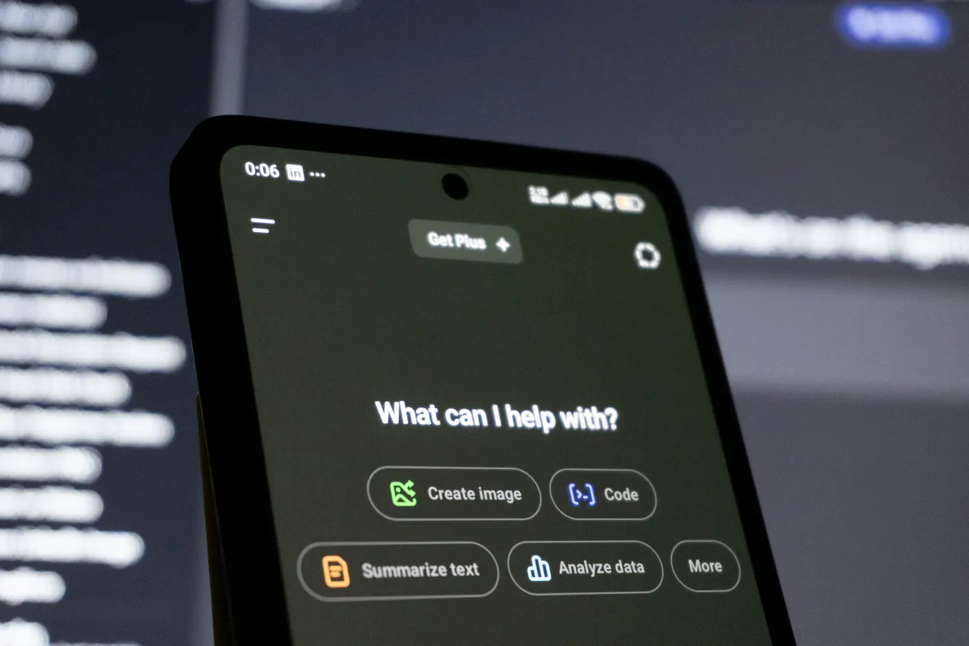 Phone showing an AI assistant asking what it can help with