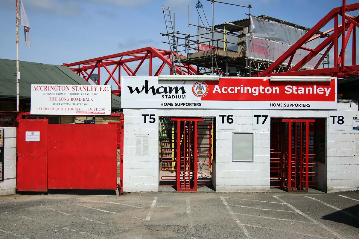 Spectators passing through a stadium entrance gate