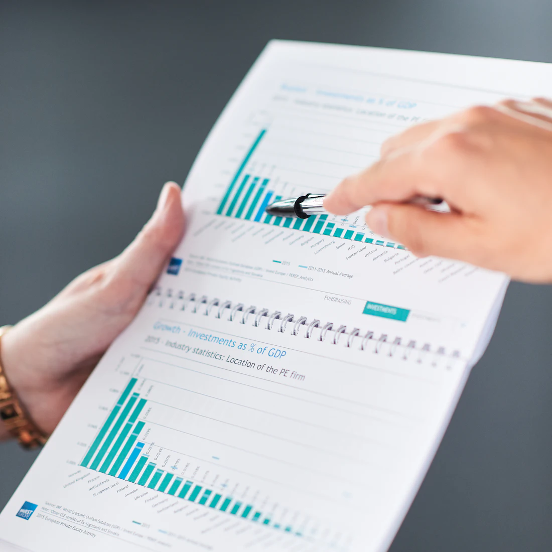 Two people auditing the numbers behind a model's output